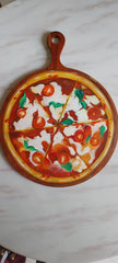 Wooden chopper board with pizza art